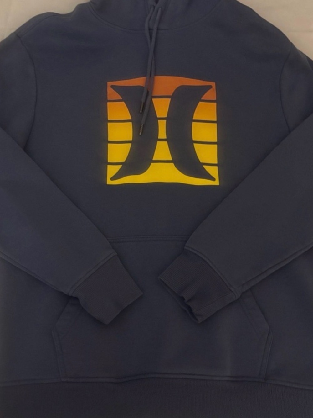 Hurley Navy Hoodie with Orange-to-Yellow Gradient Logo